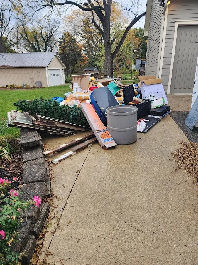 Dumpster being loaded with debris for Roofing Dumpster Rental in Deschutes River Woods